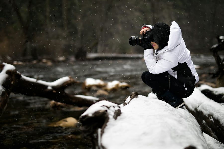 photo of photographer capturing beauty of river